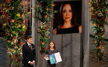 Nobel winner’s daughter accepts prize on her behalf, as Machado says she’s on way to Oslo